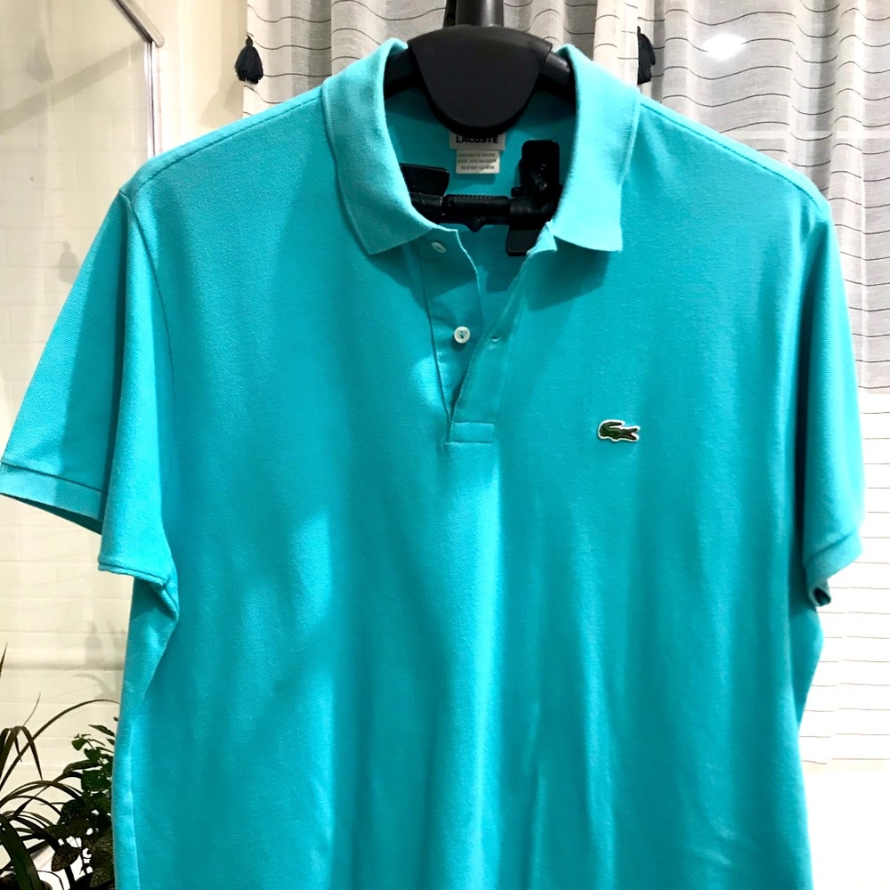 Lacoste polo XL (size 7). Has very mild stain in front, tried to show in photo.